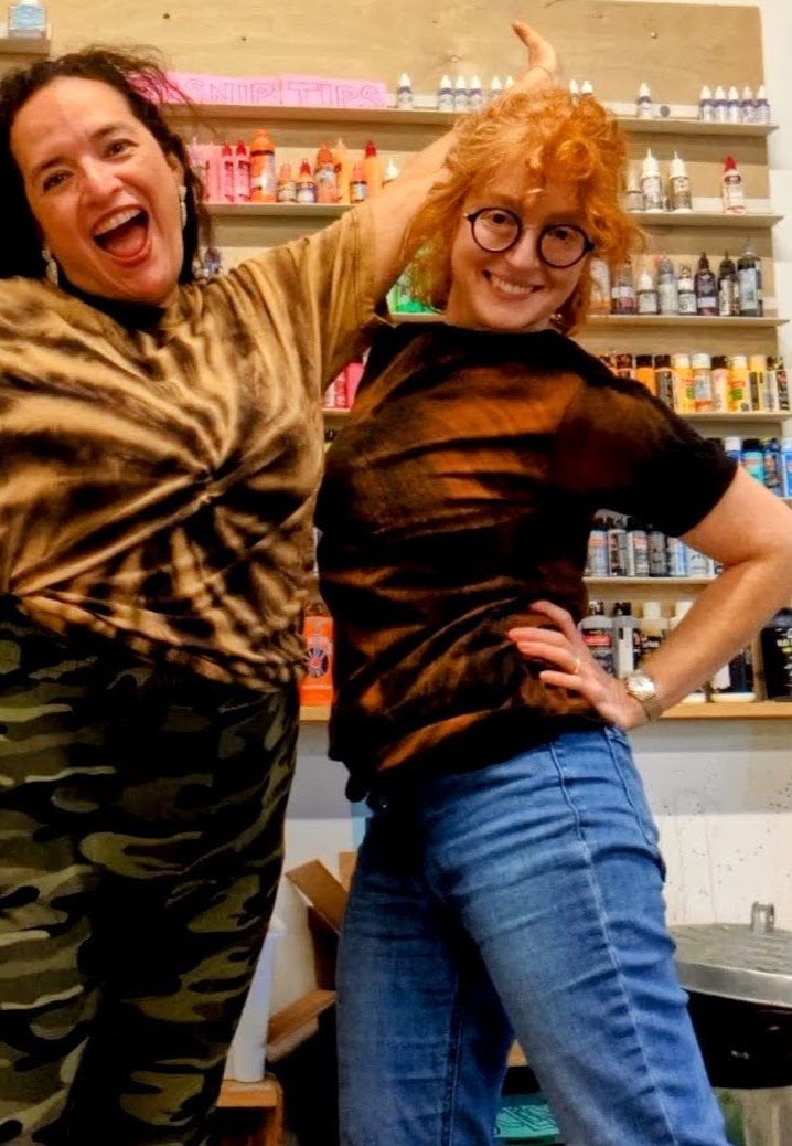 two crafters show off their reverse dyed shirts
